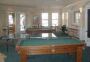 Windsor Palms Resort gamesroom with ping pong table and billiard tables inside the Resort Clubhouse - Condo rental home in orlando kissimmee florida